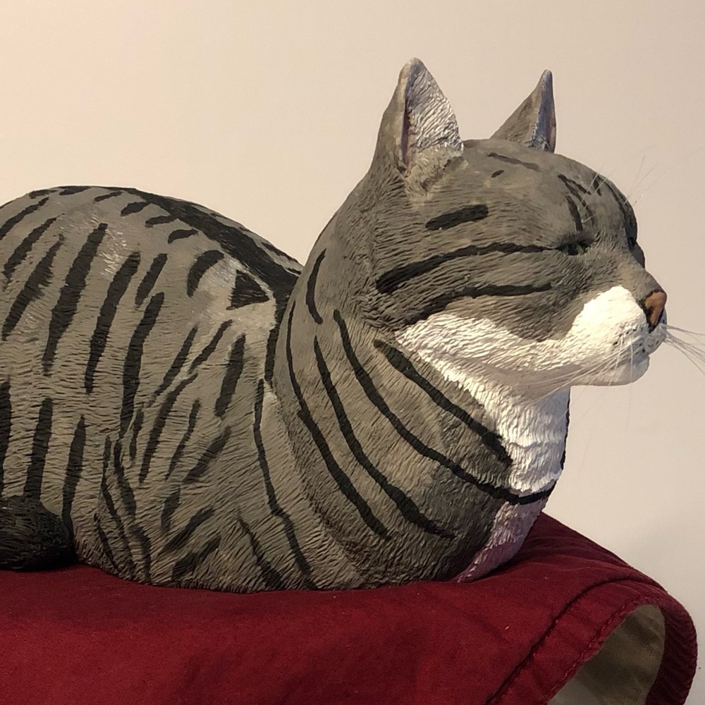 A gray tabby in a loaf position.